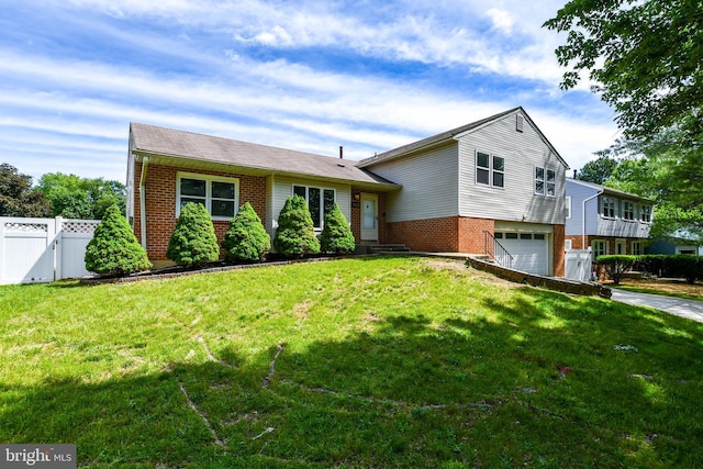 1222 Kings Tree Dr, Bowie, MD 20721 - tri-level home featuring brick siding, a garage, and driveway