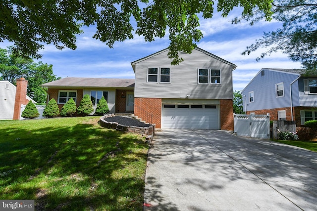 1222 Kings Tree Dr, Bowie, MD 20721 - tri-level home featuring brick siding, an attached garage, and driveway
