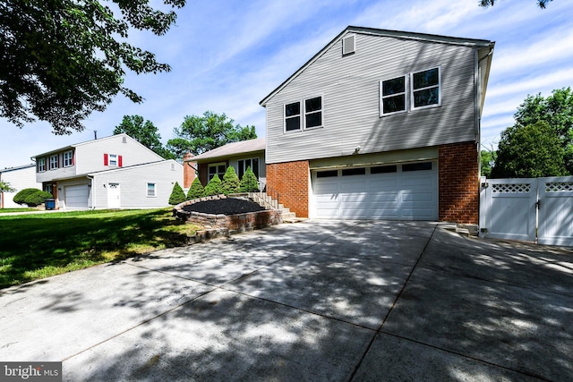 1222 Kings Tree Dr, Bowie, MD 20721 - view of front of property featuring brick siding, a garage, and driveway