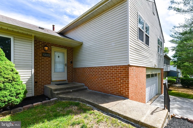 1222 Kings Tree Dr, Bowie, MD 20721 - doorway to property with brick siding, a garage, and driveway