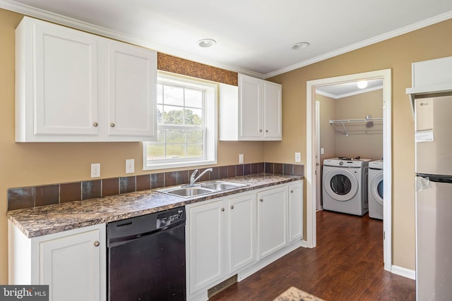 35 Dapple Gray Ln, Dover, DE 19904 - kitchen featuring dishwasher, a sink, washer and dryer, dark wood-style flooring, and white cabinetry