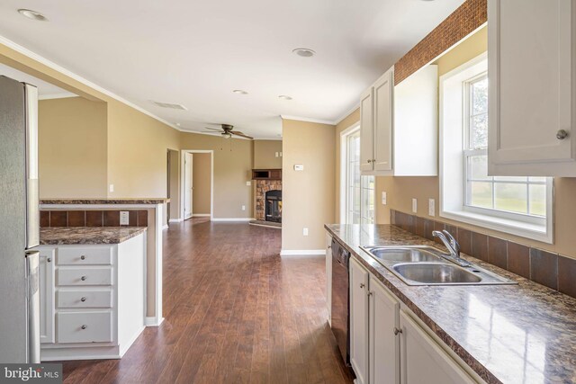 35 Dapple Gray Ln, Dover, DE 19904 - kitchen with a sink, freestanding refrigerator, dishwasher, a ceiling fan, and white cabinetry