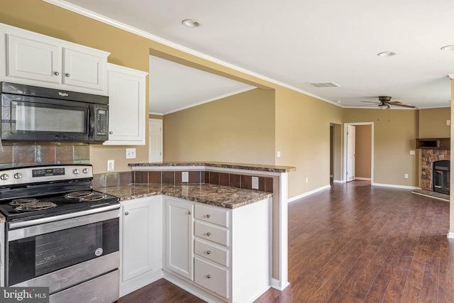 35 Dapple Gray Ln, Dover, DE 19904 - kitchen with stainless steel electric range oven, black microwave, a peninsula, a ceiling fan, and white cabinetry