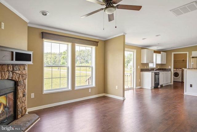 35 Dapple Gray Ln, Dover, DE 19904 - unfurnished living room featuring washer / clothes dryer, ornamental molding, dark wood-type flooring, baseboards, and a ceiling fan