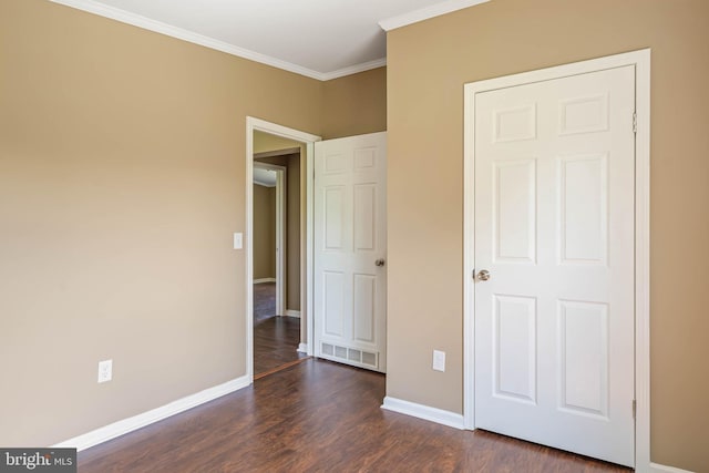 35 Dapple Gray Ln, Dover, DE 19904 - unfurnished bedroom with baseboards, dark wood-style floors, and crown molding
