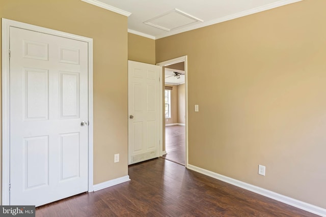 35 Dapple Gray Ln, Dover, DE 19904 - unfurnished bedroom featuring attic access, ornamental molding, dark wood-type flooring, and baseboards