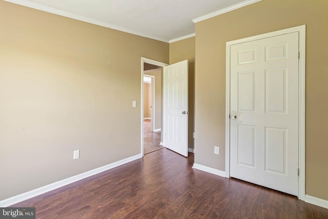 35 Dapple Gray Ln, Dover, DE 19904 - unfurnished bedroom with dark wood-style floors, crown molding, and baseboards