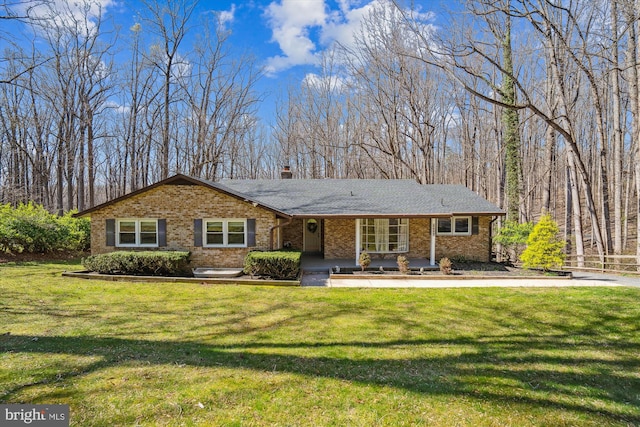 13925 Wayside Dr, Clarksville, MD 21029 - view of front of property with brick siding, a front lawn, a chimney, and roof with shingles