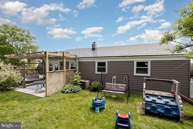 612 Colonial Dr, Dallastown, PA 17313 - rear view of property featuring a pergola, a yard, a chimney, a patio, and central AC unit