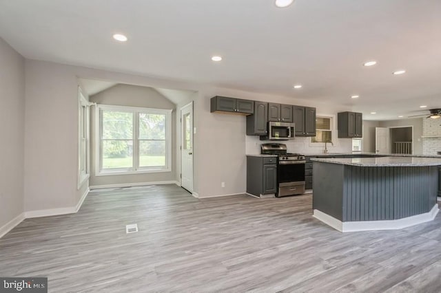 2336 Auburn Ave, Atco, NJ 08004 - kitchen featuring appliances with stainless steel finishes, baseboards, open floor plan, a ceiling fan, and light wood-style floors
