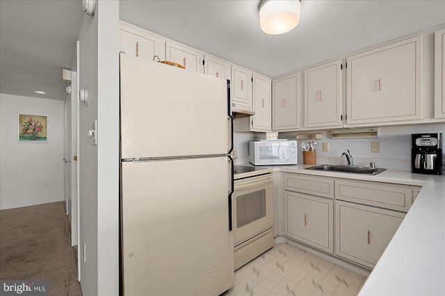 11100 Coastal Hwy Unit 904, Ocean City, MD 21842 - kitchen with white appliances, a sink, light countertops, under cabinet range hood, and light marble finish flooring