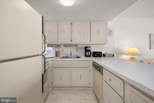 11100 Coastal Hwy Unit 904, Ocean City, MD 21842 - kitchen featuring white appliances, a sink, light countertops, and light marble finish floors