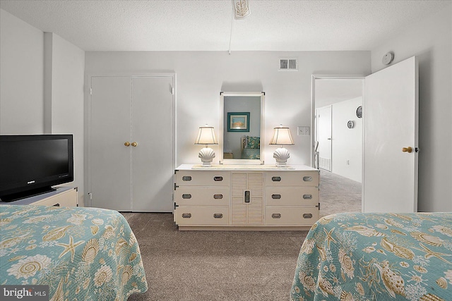 11100 Coastal Hwy Unit 904, Ocean City, MD 21842 - bedroom with dark carpet, a textured ceiling, and a closet
