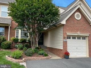 43614 Dunhill Cup Sq, Ashburn, VA 20147 - view of front facade with brick siding, a garage, and asphalt driveway