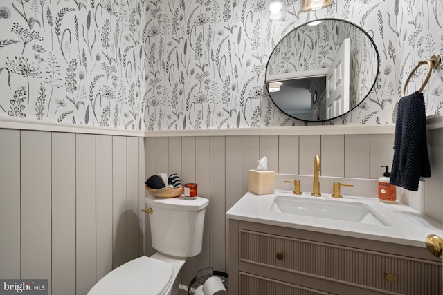 43614 Dunhill Cup Sq, Ashburn, VA 20147 - bathroom featuring toilet, vanity, and wallpapered walls