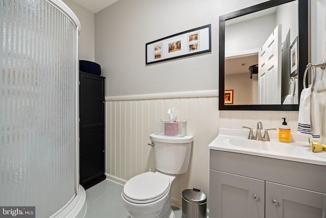 43614 Dunhill Cup Sq, Ashburn, VA 20147 - bathroom with wainscoting, vanity, a stall shower, and toilet