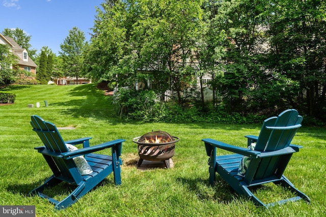 43614 Dunhill Cup Sq, Ashburn, VA 20147 - view of grassy yard with an outdoor fire pit