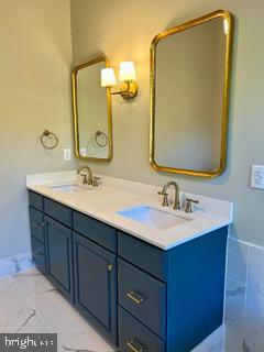 43614 Dunhill Cup Sq, Ashburn, VA 20147 - full bathroom with double vanity and baseboards