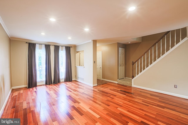 3942 Forest Valley Rd, Baltimore, MD 21234 - spare room featuring ornamental molding, light wood-style floors, stairway, and recessed lighting