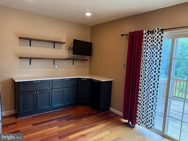 3942 Forest Valley Rd, Baltimore, MD 21234 - kitchen featuring light wood-type flooring, light countertops, open shelves, and recessed lighting