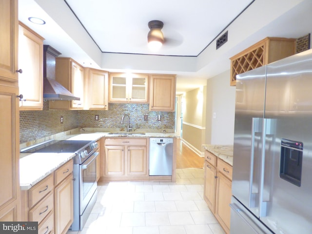 2216 Springwood Dr Unit 202, Reston, VA 20191 - kitchen with appliances with stainless steel finishes, a sink, wall chimney range hood, decorative backsplash, and light stone countertops