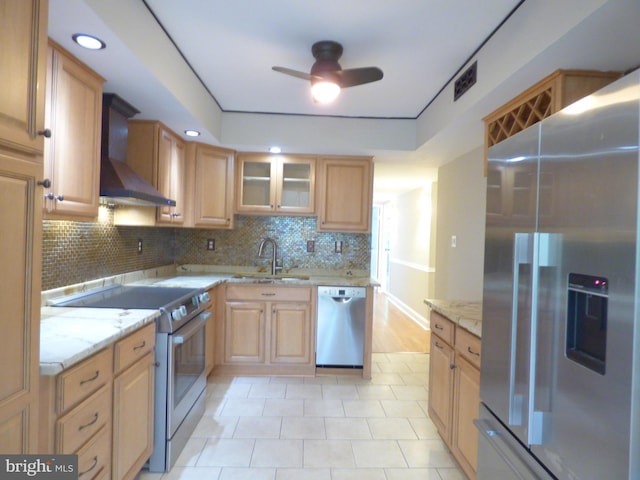 2216 Springwood Dr Unit 202, Reston, VA 20191 - kitchen featuring appliances with stainless steel finishes, wall chimney range hood, ceiling fan, light stone countertops, and tasteful backsplash