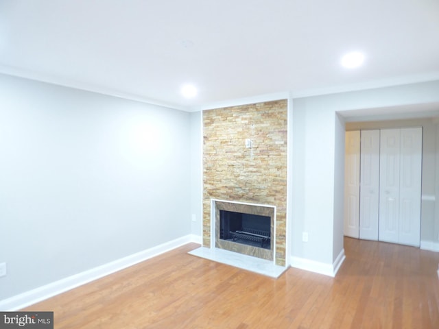 2216 Springwood Dr Unit 202, Reston, VA 20191 - unfurnished living room featuring a fireplace, wood finished floors, baseboards, and recessed lighting