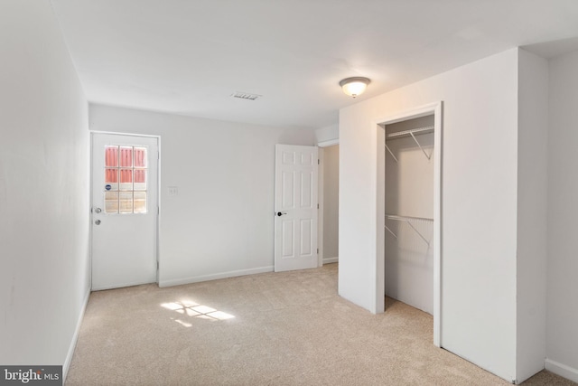 1010 Clymer Ct NE, Leesburg, VA 20176 - unfurnished bedroom featuring carpet floors, baseboards, and a closet