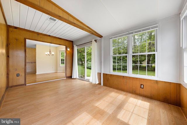 127 Mohican Ln, Little Egg Harbor Twp, NJ 08087 - spare room featuring wooden walls, a chandelier, and light wood-style floors
