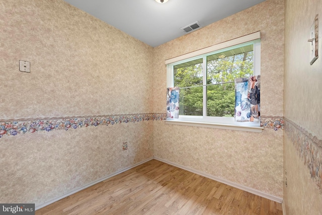 127 Mohican Ln, Little Egg Harbor Twp, NJ 08087 - unfurnished room featuring wood finished floors, baseboards, and wallpapered walls