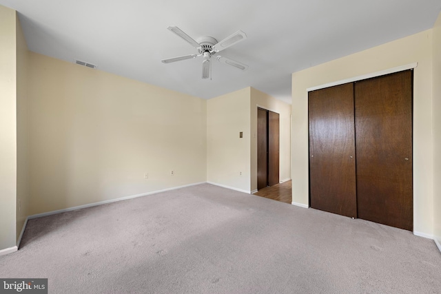 127 Mohican Ln, Little Egg Harbor Twp, NJ 08087 - unfurnished bedroom with carpet floors, baseboards, ceiling fan, and multiple closets