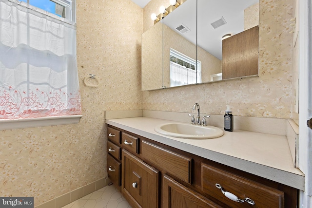 127 Mohican Ln, Little Egg Harbor Twp, NJ 08087 - bathroom with plenty of natural light, vanity, tile patterned floors, and wallpapered walls