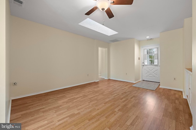 127 Mohican Ln, Little Egg Harbor Twp, NJ 08087 - unfurnished room featuring a skylight, ceiling fan, light wood-style flooring, and baseboards