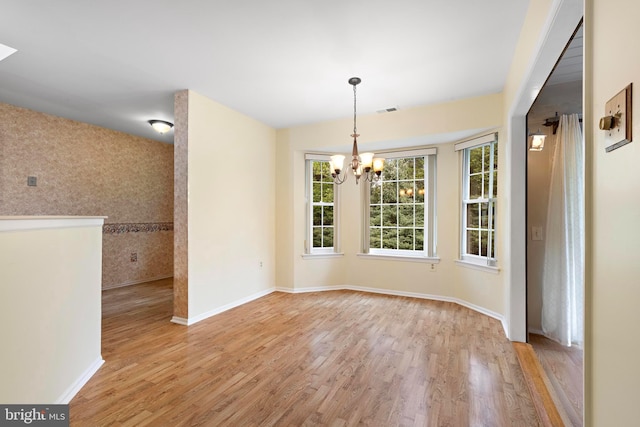 127 Mohican Ln, Little Egg Harbor Twp, NJ 08087 - unfurnished dining area featuring a chandelier, light wood finished floors, and baseboards