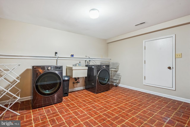 4499 Larchmont Ct, Dumfries, VA 22025 - washroom with washer / dryer, brick patterned floors, and baseboards