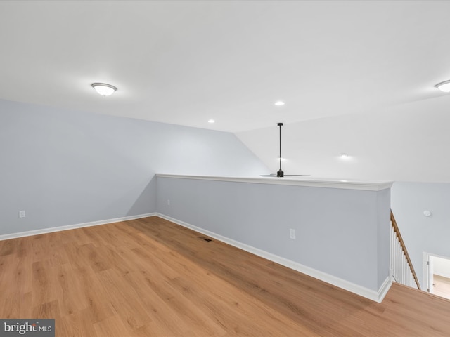 306 Prospect St, Milton, DE 19968 - empty room featuring light wood finished floors, vaulted ceiling, baseboards, ceiling fan, and recessed lighting