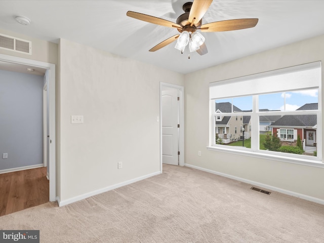 306 Prospect St, Milton, DE 19968 - carpeted spare room with baseboards, ceiling fan, and a smoke detector
