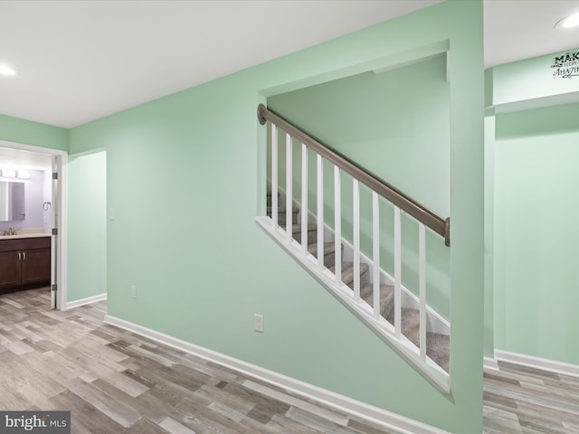 306 Prospect St, Milton, DE 19968 - stairway featuring wood finished floors, baseboards, and recessed lighting