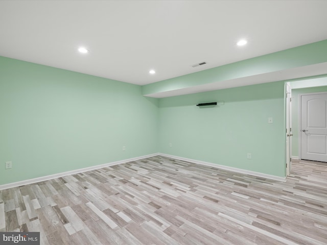 306 Prospect St, Milton, DE 19968 - finished basement featuring light wood-style floors, recessed lighting, and baseboards