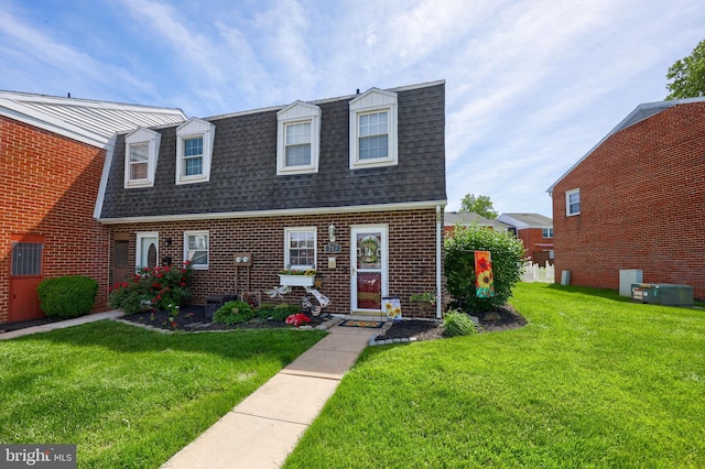 713 Hardwick Pl, York, PA 17404 - view of front of home with a shingled roof, a front yard, and brick siding