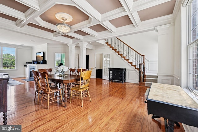 18442 Lanier Island Sq, Leesburg, VA 20176 - dining room with ornate columns, stairway, light wood-style floors, coffered ceiling, and beam ceiling