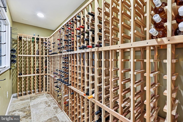 18442 Lanier Island Sq, Leesburg, VA 20176 - wine room featuring stone tile floors and recessed lighting