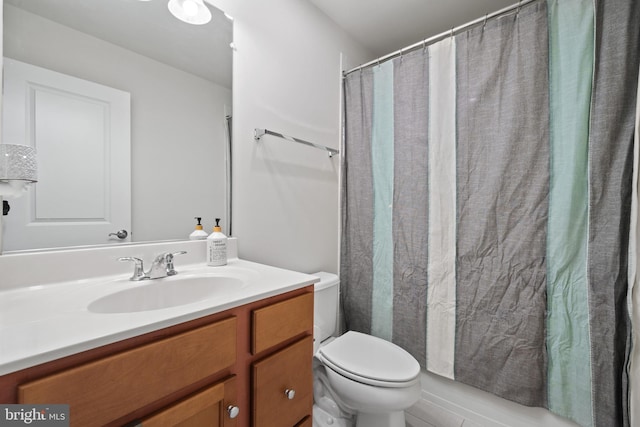 8486 Craggan Ln, Manassas, VA 20109 - bathroom with toilet, vanity, and a shower with shower curtain