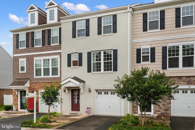 8486 Craggan Ln, Manassas, VA 20109 - view of property with stone siding, asphalt driveway, and brick siding