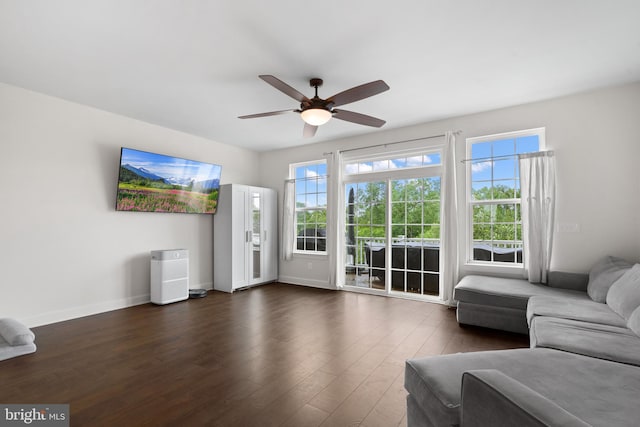 8486 Craggan Ln, Manassas, VA 20109 - living area featuring a ceiling fan, baseboards, and dark wood-style flooring