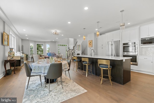 411 Merion Hill Ln, Conshohocken, PA 19428 - dining space with stairway, recessed lighting, and light wood-style floors