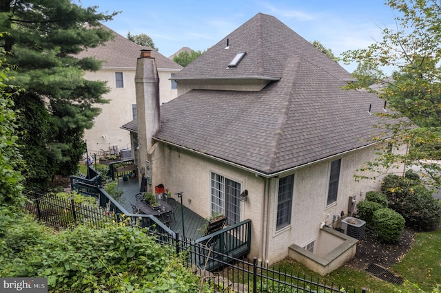 411 Merion Hill Ln, Conshohocken, PA 19428 - rear view of house featuring stucco siding, a shingled roof, stairs, and a chimney