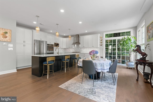 411 Merion Hill Ln, Conshohocken, PA 19428 - dining room featuring dark wood-style flooring and recessed lighting