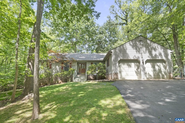 2 Whippoorwill Ln, Palmyra, VA 22963 - view of front of house featuring asphalt driveway, a front yard, and an attached garage