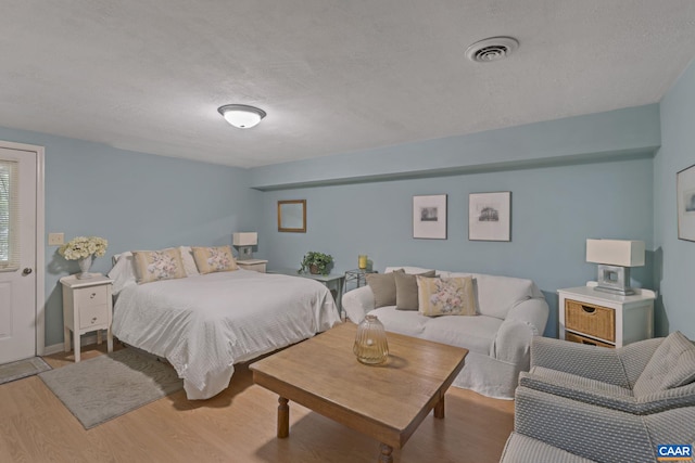 2 Whippoorwill Ln, Palmyra, VA 22963 - bedroom featuring wood finished floors and a textured ceiling